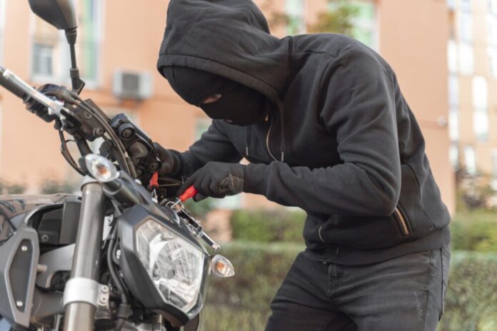 close-up-man-preparing-steal-motorcycle (1)
