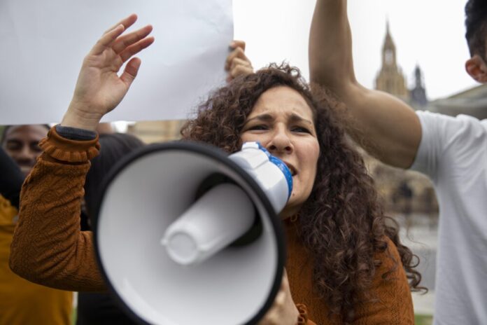 close-up-woman-shouting-into-megaphone
