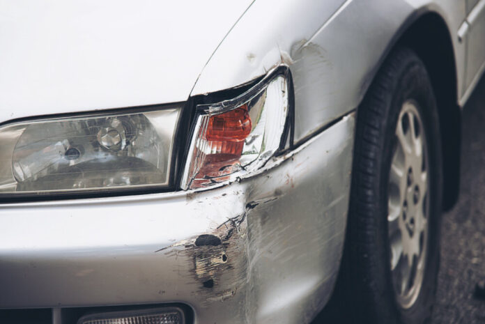 Car damage on road accident - car insurance concept