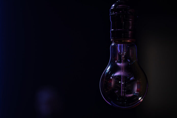 Close up of a non-burning lamp on a blurred dark background.