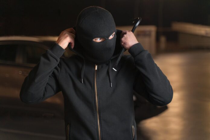 close-up-man-trying-break-into-car (2)