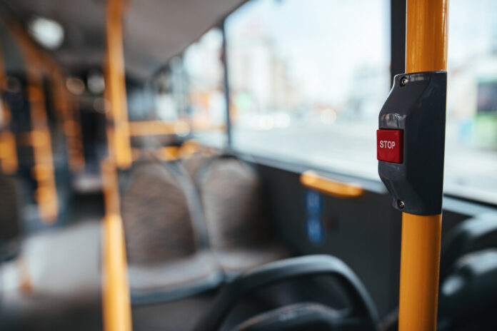 Close-up of handle in empty bus during global coronavirus epidem
