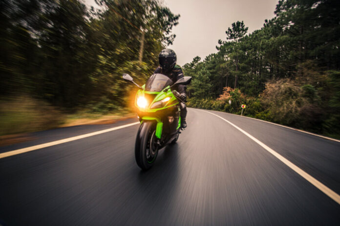 driving-green-neon-color-motorcycle-road-dusk-time (1)